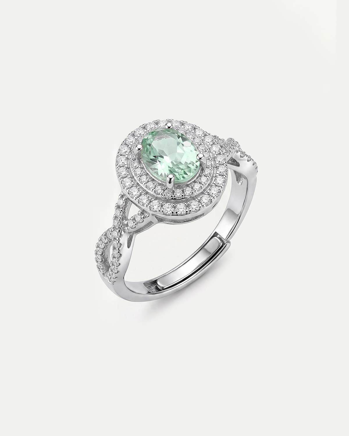 Серебристое кольцо с с овальной вставкой крупного зеленого фианита